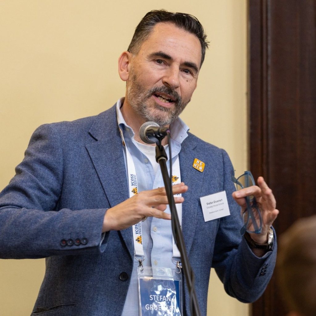 Stefan Gruenert - a man speaking into a microphone