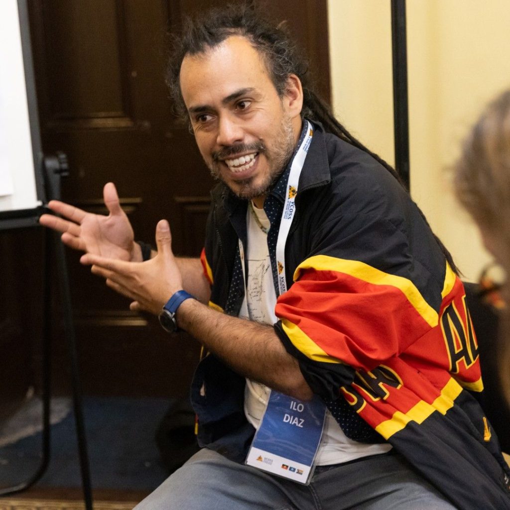 Ilo Diaz - a man speaking and gesticulating